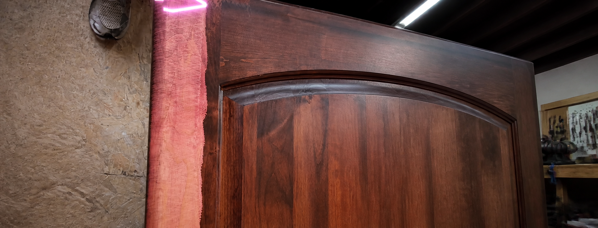 Laser cleaning in progress on a wood door